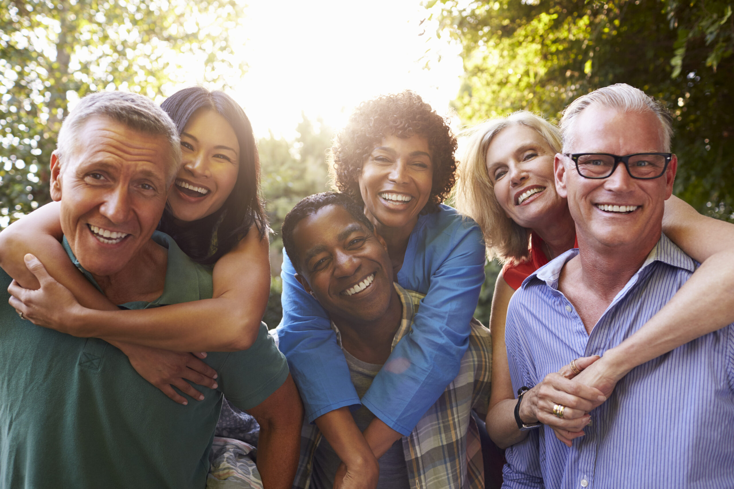 Mature friends embracing