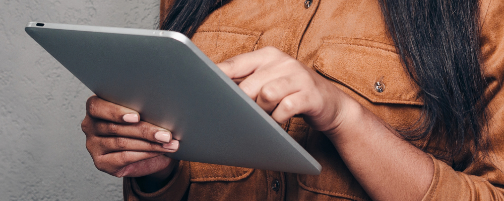 Person with tablet in hand