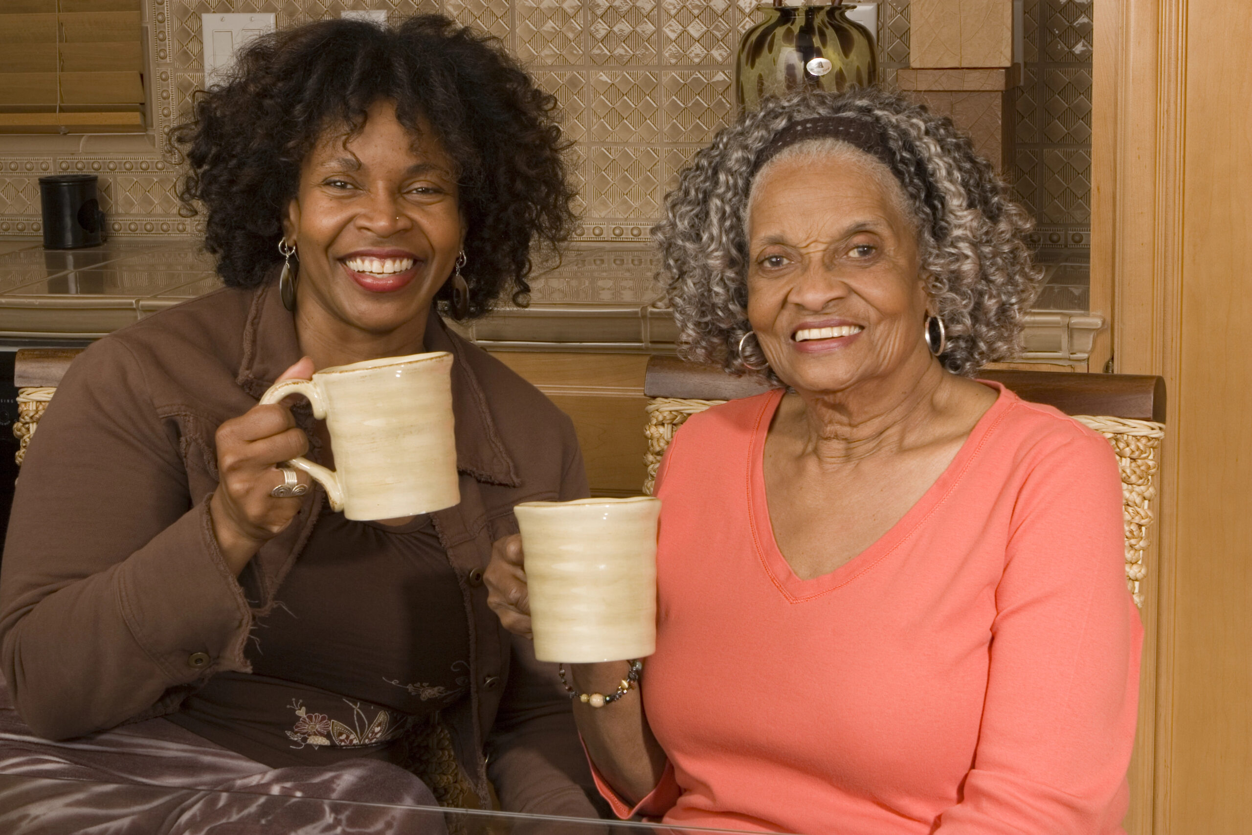 Senior woman having coffee with her daughter