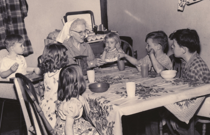 Homemaker in the 1940s taking care of a family of children